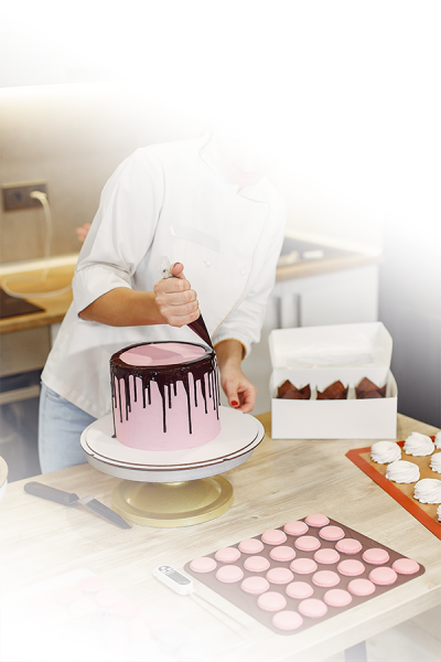 confectioner-uniform-decorates-cake